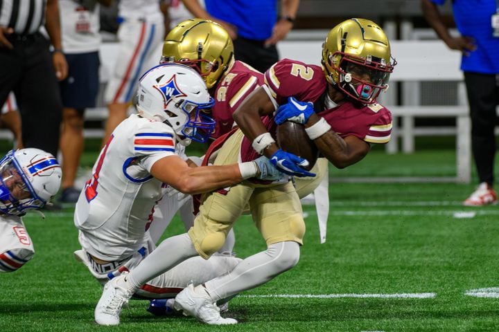 Brookwood's Nijous Ross breaks away from the defense during the Corky Kell Classic at Mercedes-Benz Stadium. (Jamie Spaar for the Atlanta Journal Constitution)