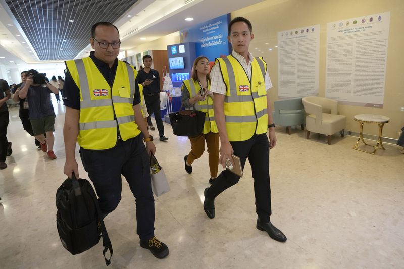 Staff members from the British Embassy arrive at Samitivej Srinakarin Hospital in Bangkok, Thailand, Wednesday, May 22, 2024, to visit passengers from Britain injured in the flight that hit severe turbulence over the Indian Ocean on Tuesday. The Singapore Airlines flight descended 6,000 feet (around 1,800 meters) in about three minutes, the carrier said Tuesday. A British man died and authorities said dozens of passengers were injured, some severely. (AP Photo/Sakchai Lalit)