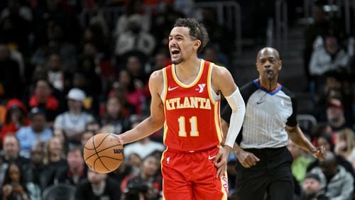 Atlanta Hawks guard Trae Young (11) shouts instructions as he brings the ball upcourt during the second half in an NBA basketball game at State Farm Arena, Saturday, February 10, 2024, in Atlanta. Atlanta Hawks won 122 - 113 over Houston Rockets. (Hyosub Shin / Hyosub.Shin@ajc.com)