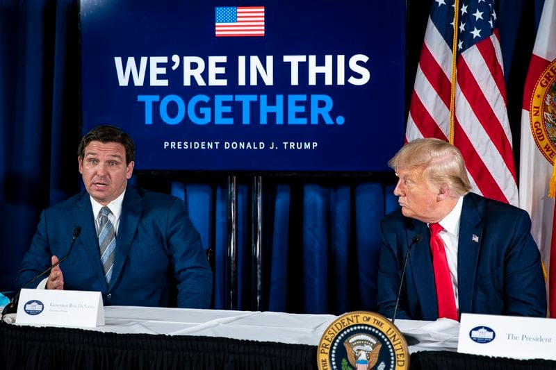 Then-President Donald Trump and Gov. Ron DeSantis of Florida participate in a roundtable discussion regarding both the pandemic and storm preparedness, in Belleair, Fla., on July 31, 2020. Trump and DeSantis downplayed suggestions of any rivalry between them. (Al Drago/The New York Times).