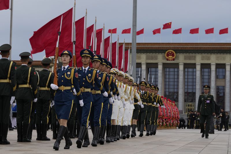 Members of a honor guard rehearse before a ceremony to mark Martyrs' Day ahead of the 75th anniversary of the founding of the People's Republic of China on Tiananmen Square in Beijing, Monday, Sept. 30, 2024. (AP Photo/Ng Han Guan)