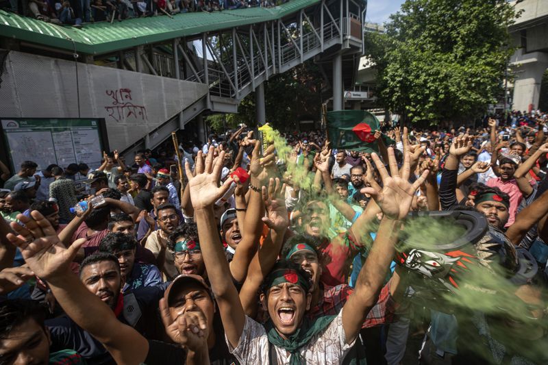 FILE- Protesters shout slogans as they celebrate Prime Minister Sheikh Hasina's resignation, in Dhaka, Bangladesh, Aug. 5, 2024. (AP Photo/Rajib Dhar, File)