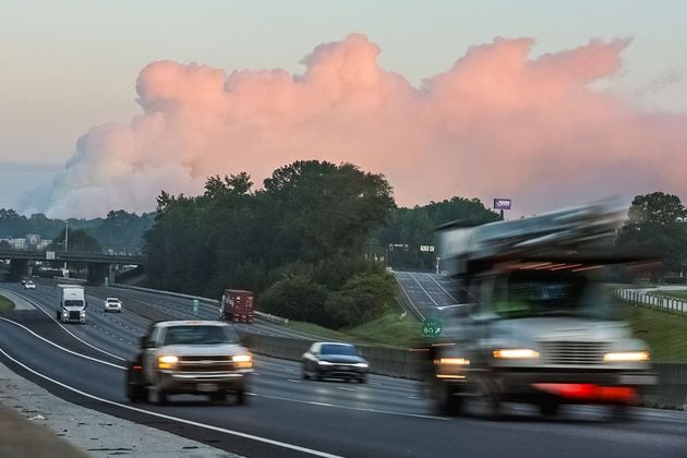 The large plume of smoke from a chemical plant fire on Sunday is still visible from I-20 eastbound near West Avenue in Conyers, Georgia, on Sept. 30, 2024. (John Spink/The Atlanta Journal-Constitution/TNS)