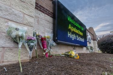 Students and well wishers left flowers at the school’s sign at Apalachee High School in Winder on Thursday, Sept. 5, 2024. A 14-year-old is accused of shooting and killing two fellow students and two teachers and injuring nine others at Apalachee High School on Wednesday. (John Spink/AJC)