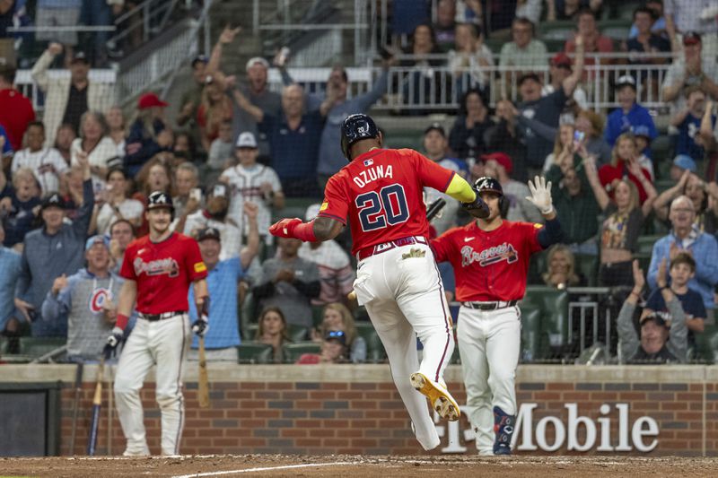 Atlanta Braves' Marcell Ozuna scores after an error in the eighth inning of a baseball game against the Kansas City Royals, Friday, Sept. 27, 2024, in Atlanta. (AP Photo/Jason Allen)