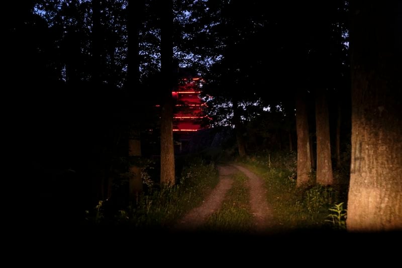 The Reading Pagoda, a historic landmark and symbol of the city in Pennsylvania for more than a century is illuminated at night atop Mount Penn, Pa., on Sunday, June 16, 2024. (AP Photo/Luis Andres Henao)