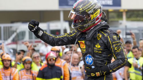 Ferrari driver Charles Leclerc of Monaco celebrates after winning the Formula One Italian Grand Prix race at the Monza racetrack, in Monza, Italy, Sunday, Sept. 1, 2024. (AP Photo/Luca Bruno)