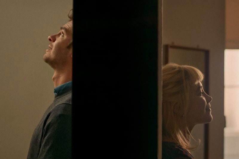 This image released by A24 shows Andrew Garfield, left, and Florence Pugh in a scene from "We Live In Time." (A24 via AP)