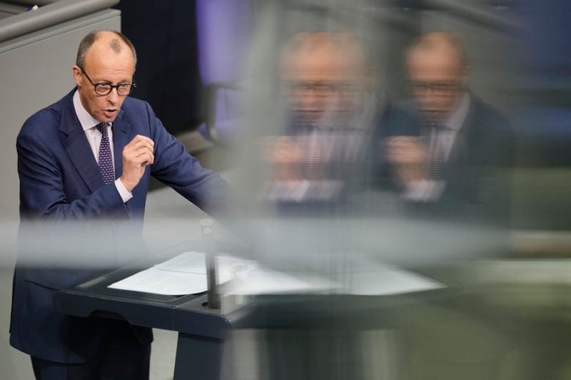 FILE - Opposition leader Friederich Merz delivers a speech during a debate about Germany's budget crisis at the parliament Bundestag in Berlin, Germany, Nov. 28, 2023. (AP Photo/Markus Schreiber)