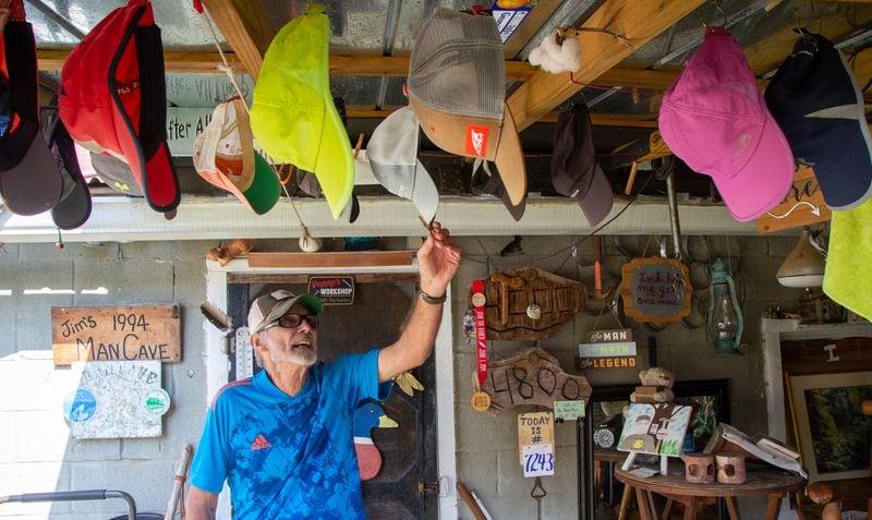 Jim Merritt, 73, of Buford, kept track of which hat he would wear for his daily run by putting a clothes pin on the next one in rotation. PHIL SKINNER FOR THE ATLANTA JOURNAL-CONSTITUTION.