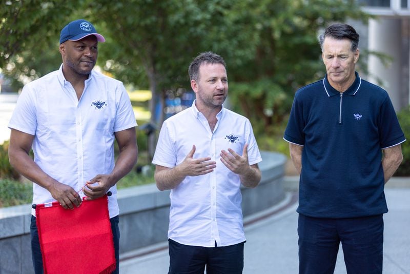 (L-R) Marcus Gayle, ambassador for Brentford Football Club; Greig Mailer, corporate affairs director for Brentford Football Club; and Gary Blissett, ambassador for Brentford Football Club; appear in a press conference at Emory University Hospital in Atlanta on Wednesday, July 26, 2023. Emory teamed up with with Brentford Football Club to promote the importance of an emergency response plan in athletics. (Arvin Temkar / arvin.temkar@ajc.com)