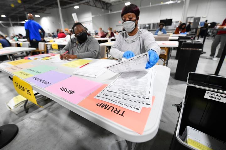 Workers count ballots as votes for President are recounted at the Gwinnett County elections office on Friday, Nov.13, 2020 in Lawrenceville. (JOHN AMIS FOR THE ATLANTA JOURNAL-CONSTITUTION)