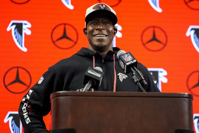 Atlanta Falcons head coach Raheem Morris speaks during a news conference after an NFL football game against the New Orleans Saints, Sunday, Sept. 29, 2024, in Atlanta. The Atlanta Falcons won 26-24. (AP Photo/John Bazemore)