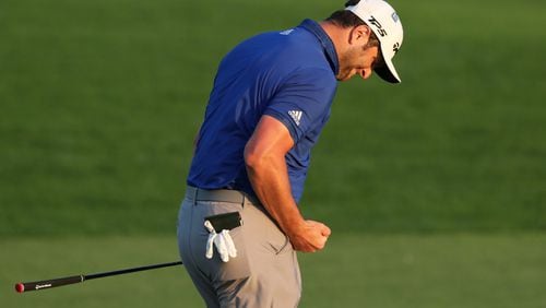 Jon Rahm reacts to missing his par putt on the 18th green during the third round of the Masters Saturday at Augusta National. (Curtis Compton / Curtis.Compton@ajc.com)