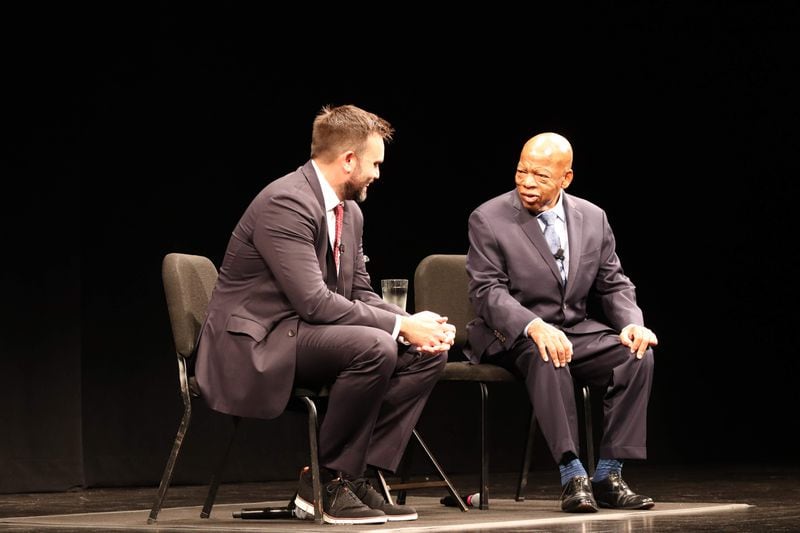 Aydin, left, with his "March" series co-author, Congressman John Lewis.