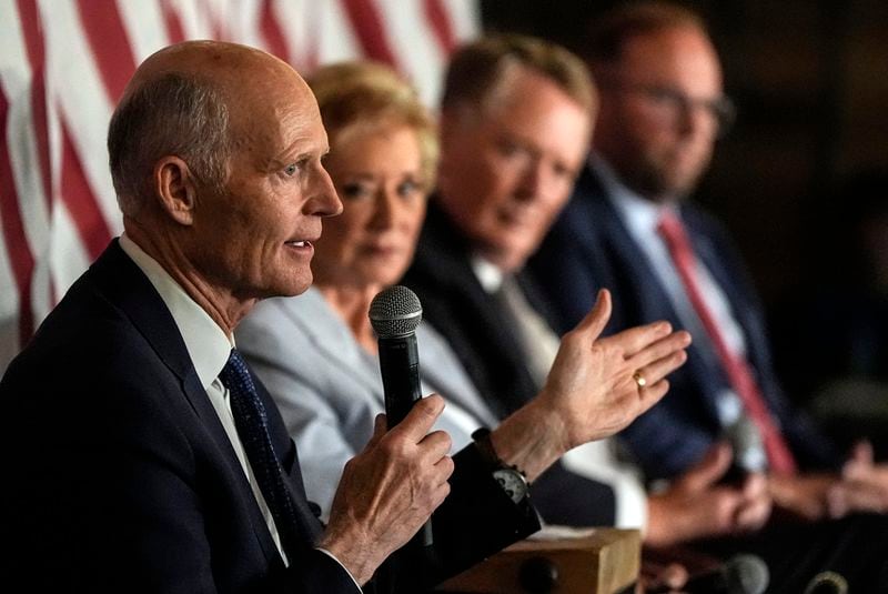 Sen. Rick Scott, R-Fla., speaks at a gathering in Braselton on Tuesday in support of former President Donald Trump.