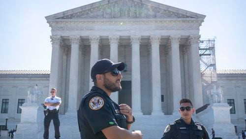 Supreme Court Police officers stand on duty outside of the Supreme Court building on Thursday, June 13, 2024, in Washington. (AP Photo/Mark Schiefelbein)