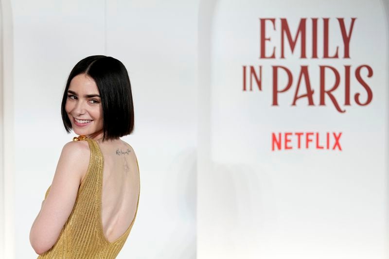 Actress Lily Collins arrives at the premiere of "Emily in Paris", in Rome, Tuesday, Sept. 10, 2024. (AP Photo/Andrew Medichini)