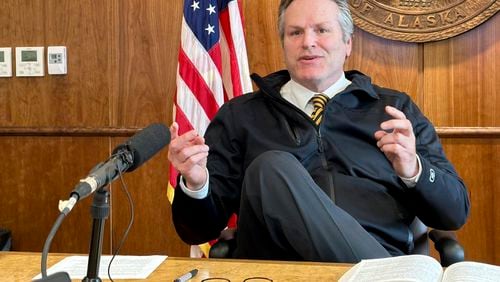 FILE - Alaska Gov. Mike Dunleavy gestures while speaking with reporters on May 1, 2024, in Juneau, Alaska. (AP Photo/Becky Bohrer, File)