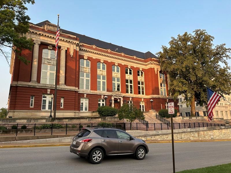 A vehicle passes in front of the Missouri Supreme Court building on Tuesday, Sept. 10, 2024, in Jefferson City, Mo., in advance of oral arguments on whether an abortion rights constitutional amendment should be removed from the general election ballot. (AP Photo/David A. Lieb)