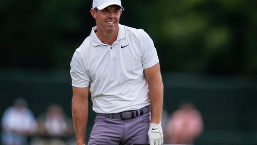 Rory McIlroy, of Northern Ireland, watches his ball on the eighth hole during the second round of the Tour Championship golf tournament, Friday, Aug. 30, 2024, in Atlanta. (AP Photo/Mike Stewart)