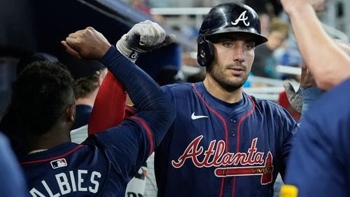 Atlanta Braves' Matt Olson celebrates a two-run home run during the seventh inning of a baseball game against the Miami Marlins, Saturday, Sept. 21, 2024, in Miami. (AP Photo/Marta Lavandier)