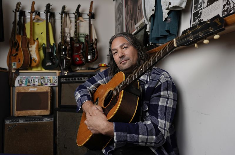 Adam Granduciel, leader of the band The War on Drugs, poses for a portrait at his studio on Monday, Aug. 26, 2024, in Burbank, Calif. (AP Photo/Chris Pizzello)