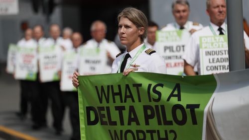 Delta Air Lines pilots hit the picket line demanding working better conditions on Thursday, June 30, 2022. The pilots are members of the Delta Airlines Pilots Association, pushing for a new labor contract among their demands. Miguel Martinez / Miguel.martinezjimenez@ajc.com