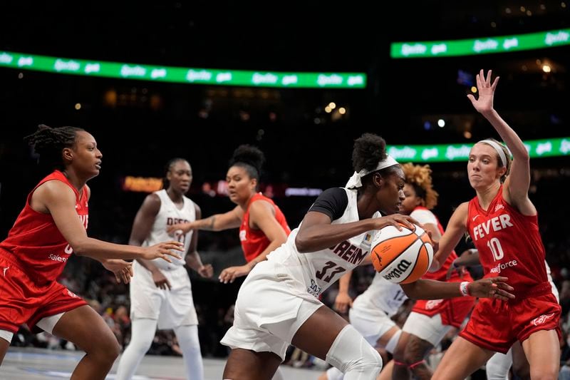 Atlanta Dream guard Maya Caldwell (33) dribbles the ball in the second half of an WNBA basketball game against the Indiana Fever, Monday, Aug. 26, 2024, in Atlanta. (AP Photo/Brynn Anderson)