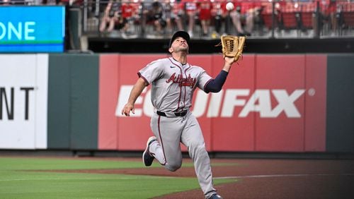 Atlanta Braves right fielder Ramon Laureano catches a foul ball hit by St. Louis Cardinals' Nolan Arenado during the seventh inning in the second game of a baseball doubleheader Wednesday, June 26, 2024, in St. Louis. (AP Photo/Joe Puetz)