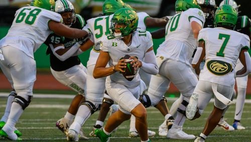 Quarterback for Buford, Dayton Raiola, looks to make a pass during the Buford at Roswell high school football game in Roswell, Georgia on September 6, 2024. (Jamie Spaar for the Atlanta Journal Constitution)