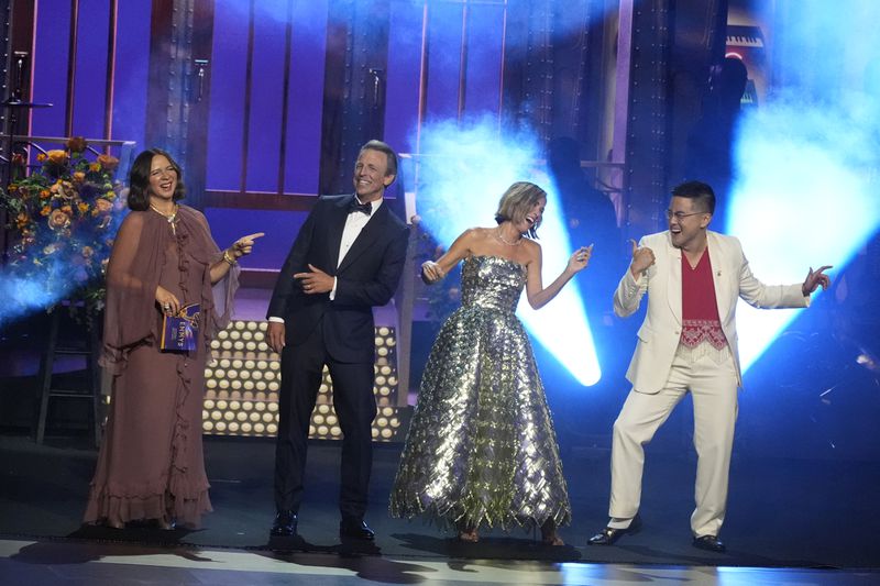 Maya Rudolph, from left, Seth Meyers, Kristen Wiig, and Bowen Yang present the award for outstanding writing for a variety special during the 76th Primetime Emmy Awards on Sunday, Sept. 15, 2024, at the Peacock Theater in Los Angeles. (AP Photo/Chris Pizzello)