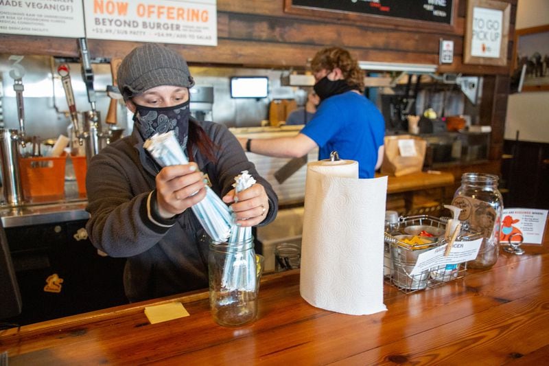 Farm Burger manager Dana Harrison wears a mask while getting ready for their lunch rush in Decatur Monday, February 28, 2020.  STEVE SCHAEFER FOR THE ATLANTA JOURNAL-CONSTITUTION
