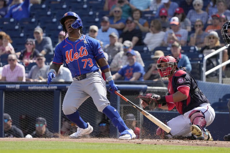 New York Mets' Luisangel Acuna singles during the second inning of a spring training baseball game against the Washington Nationals Monday, Feb. 26, 2024, in West Palm Beach, Fla. (AP Photo/Jeff Roberson)