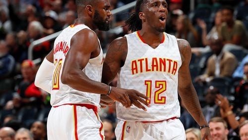 Taurean Prince (12) of the Hawks reacts after assisting on a 3-point basket by Tim Hardaway Jr. (10) against the Milwaukee Bucks at Philips Arena on November 16, 2016 in Atlanta, Georgia. (Photo by Kevin C. Cox/Getty Images)