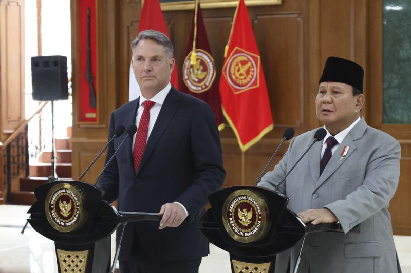 In this photo released by Indonesia's Ministry of Defense, Australia's Deputy Prime Minister and Defense Minister Richard Marles, left, and Indonesian Defense Minister Prabowo Subianto speak to the media during a press conference after their meeting at the Military Academy in Magelang, Central Java, Indonesia, Thursday, Aug. 29, 2024. (Indonesian Ministry of Defense via AP)