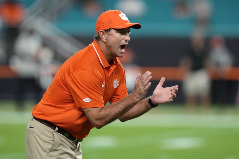 FILE - Clemson head coach Dabo Swinney walks on the field before an NCAA college football game against Miami, Oct. 21, 2023, in Miami Gardens, Fla. (AP Photo/Lynne Sladky, File)