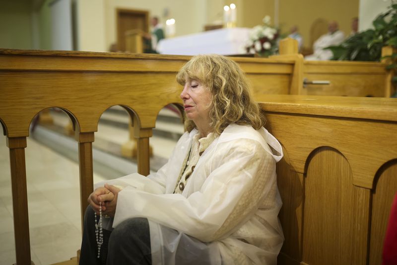 A pilgrim recites her prayers inside the St. James Church in Medjugorje, Bosnia, Thursday, Sept. 19, 2024. (AP Photo/Armin Durgut)