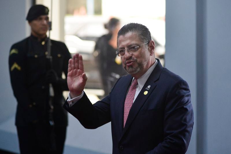 Costa Rica's President Rodrigo Chaves Robles waves to the press as he arrives at the swearing-in ceremony of Panama's President-elect Jose Raul Mulino at the Atlapa Convention Centre in Panama City, Monday, July 1, 2024. (AP Photo/Agustin Herrera)