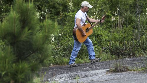 Tony Taylor, 69, says according to his calendar, he has climbed Stone Mountain’s Walk Up Trail 4000-times. He plays the guitar as he walks up and down the mountain.