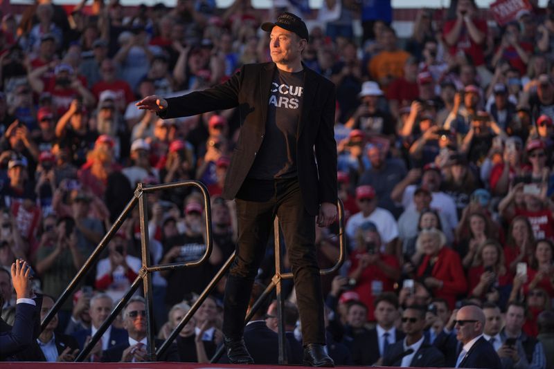 Elon Musk walks onto stage as Republican presidential nominee former President Donald Trump speaks at a campaign rally at the Butler Farm Show, Saturday, Oct. 5, 2024, in Butler, Pa. (AP Photo/Evan Vucci)