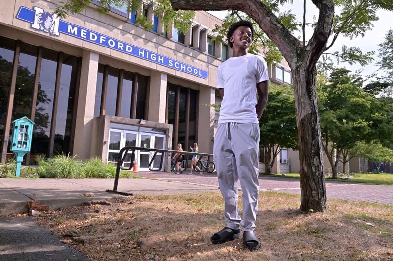 Flerentin “Flex” Jean-Baptiste, 16, of Medford, Mass., poses for a photo at Medford High School, Friday, Aug. 2, 2024, in Medford. (AP Photo/Josh Reynolds)