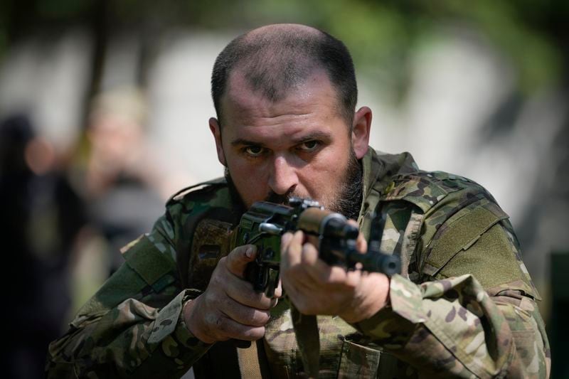 FILE – A newly recruited soldier trains in Kyiv, Ukraine, on Friday, May 17, 2024. Slowly but steadily this summer, Russian troops are forging through Ukraine's defenses in a relentless onslaught, prompting the West to push for new weapons and strategies to shore up Kyiv. (AP Photo/Efrem Lukatsky, File)