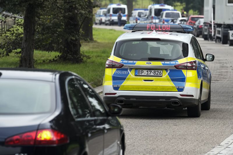 German police escort a French car to a control near the border to Belgium, in Aachen, Germany, Monday, Sept. 16, 2024, as Germany begins carrying out checks at all its land borders. (AP Photo/Martin Meissner)