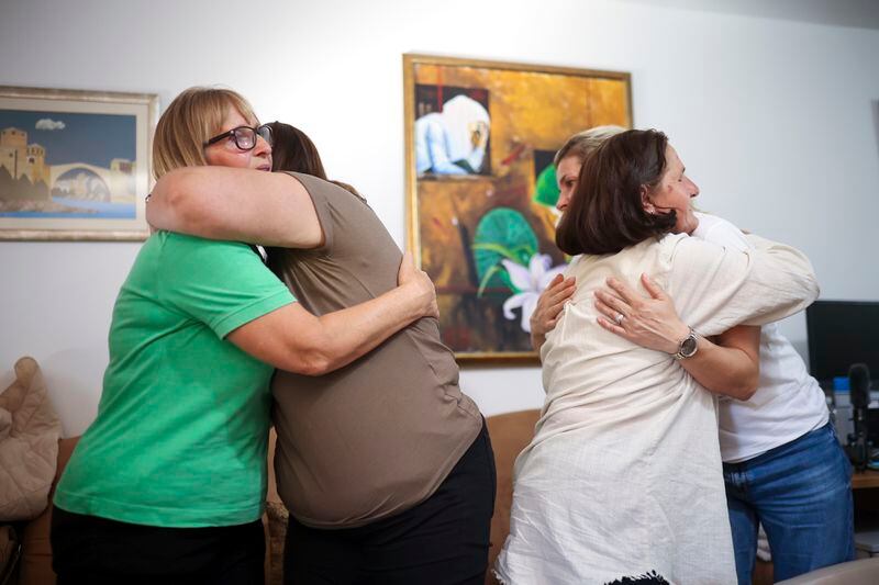 Members of the association Mothers of Srebrenica react after the United Nations General Assembly adopted a resolution declaring July 11 the International Day of Reflection and Commemoration of the 1995 genocide in Srebrenica, in Potocari, Bosnia, Thursday, May 23, 2024. (AP Photo/Armin Durgut)