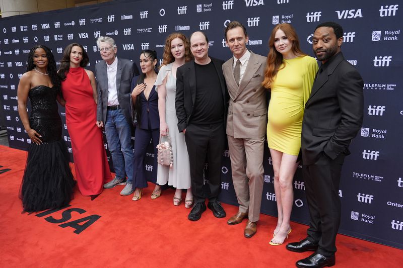 The Pocket Queen, from left, Kate Siegel, Stephen King, Q'orianka Kilcher, Annalise Basso, Mike Flanagan, Tom Hiddleston, Karen Gillan, and Chiwetel Ejiofor attend the premiere of "The Life of Chuck" during the Toronto International Film Festival on Friday, Sept. 6, 2024, at Princess of Wales Theatre in Toronto. (AP Photo/Chris Pizzello)