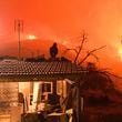 A wildfire approaches the village of Kallithea as fanned by strong winds raged uncontrolled despite the attempts of hundreds of firefighters to stop it, some 149 kilometers (93 miles) west of Athens, Greece, in the region of Corinthia, late Sunday, Sept. 29, 2024. (AP Photo)