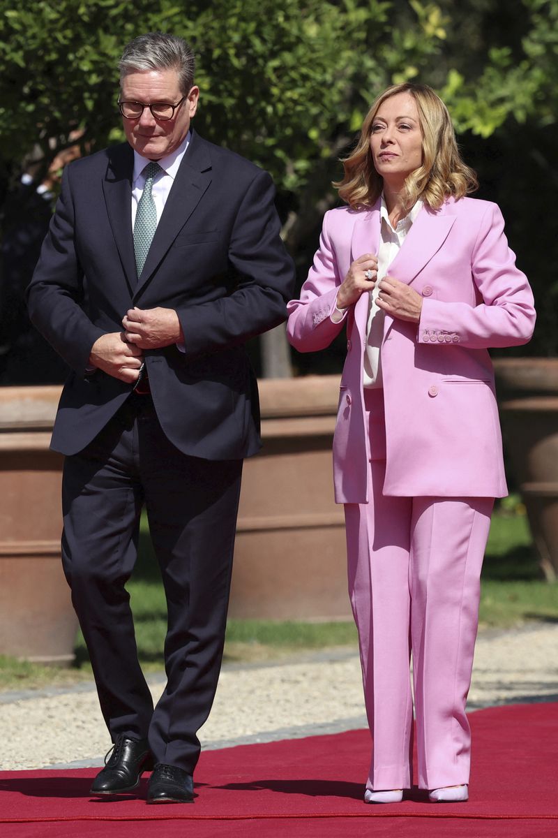 British Prime Minister Keir Starmer attends a welcome ceremony with Italian Prime Minister Giorgia Meloni, right, on the occasion of his visit, at Villa Doria Pamphilj, in Rome, Monday, Sept. 16, 2024. (Phil Noble/Pool Photo via AP)