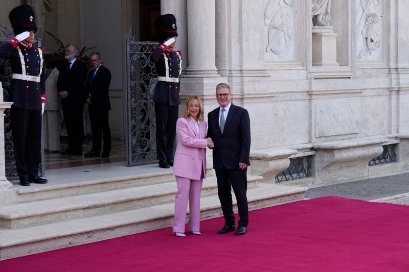 Italian Premier Giorgia Meloni, left, welcomes U.K. Prime Minister Keir Starmer as they meet at Villa Panphilj in Rome, Monday, Sept. 16, 2024. U.K. Prime Minister Keir Starmer is meeting Italian Premier Giorgia Meloni in Rome on Monday, as the two very different politicians, from left and right, seek common cause to curb migrants reaching their shores by boat. The visit comes after at least eight seaborne migrants died off the French coast over the weekend. (AP Photo Andrew Medichini)