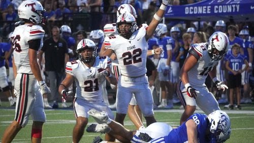 Linebacker Luke Burnett signals that North Oconee has come up with another big play.